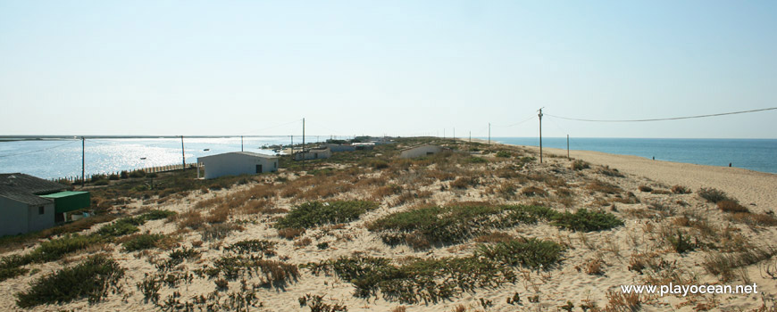 Houses on the dunes of Praia de Faro (Sea) Beach