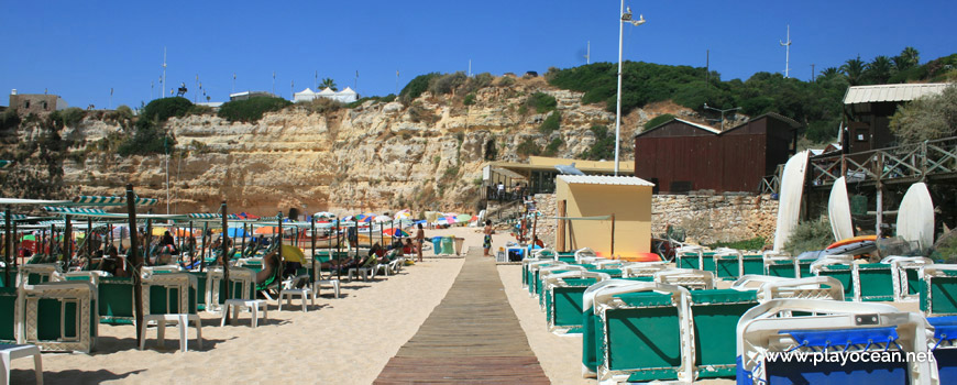 Sunbeds an awnings at Praia da Senhora da Rocha Beach