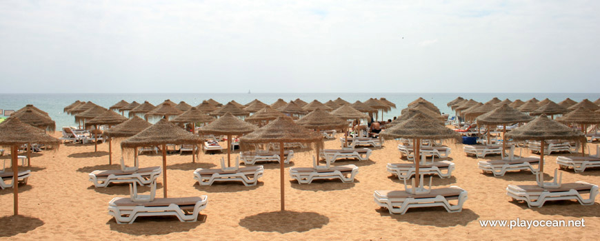 Straw umbrellas at Praia de Vale do Lobo Beach